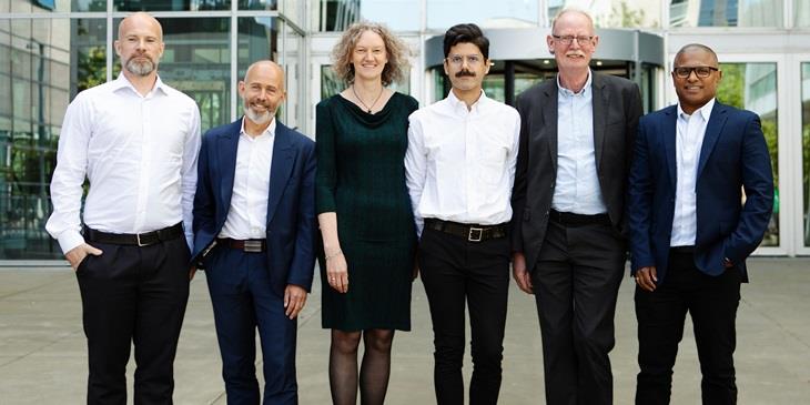 University Management standing in front of RLV campus