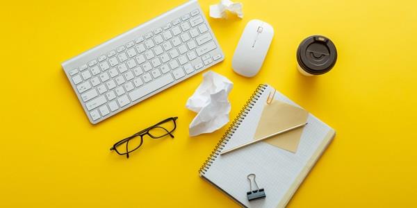 Keypad, glasses, paper, pen and coffee