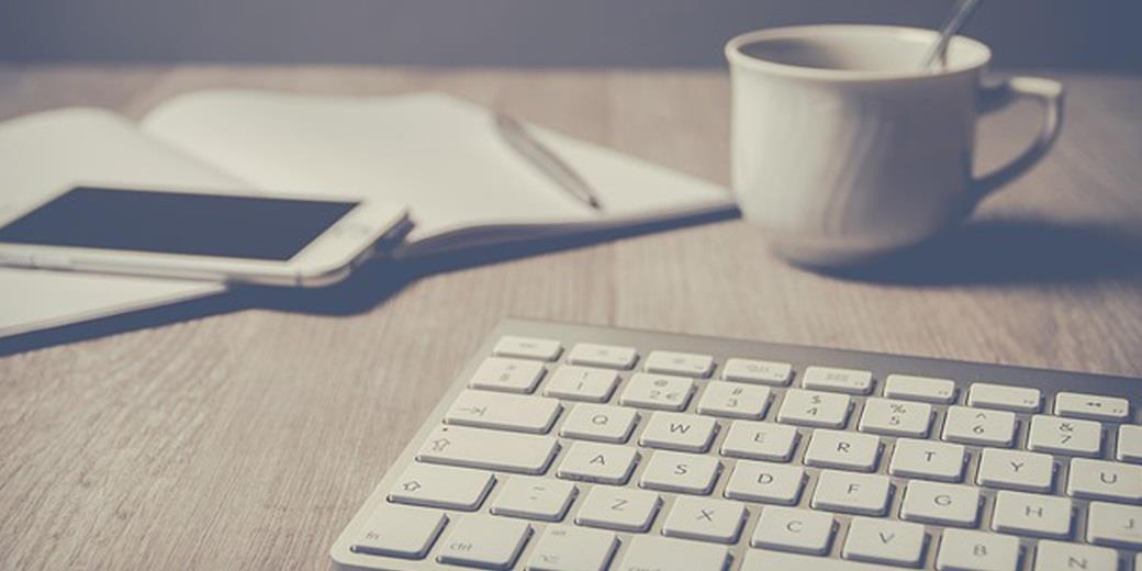 Keyboard, mobile phone and coffee cup