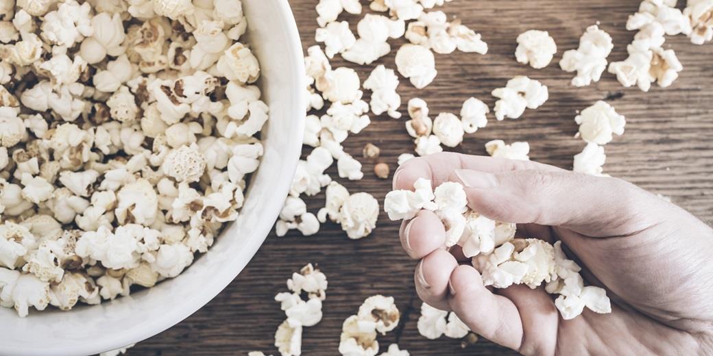 Grapping popcorn from a bowl