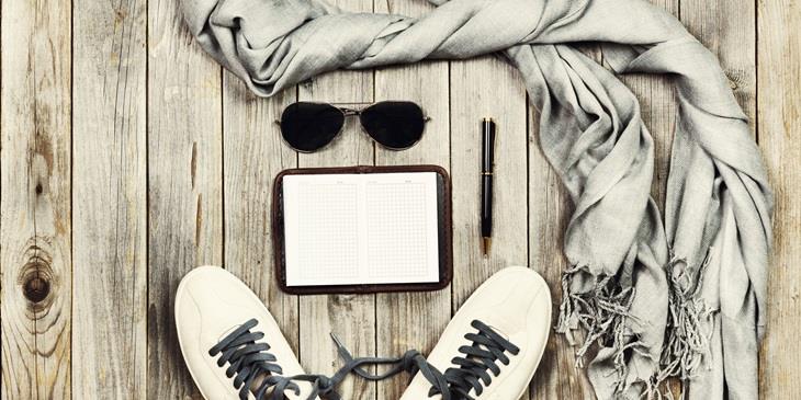 Sneakers, sunglasses and a notebook