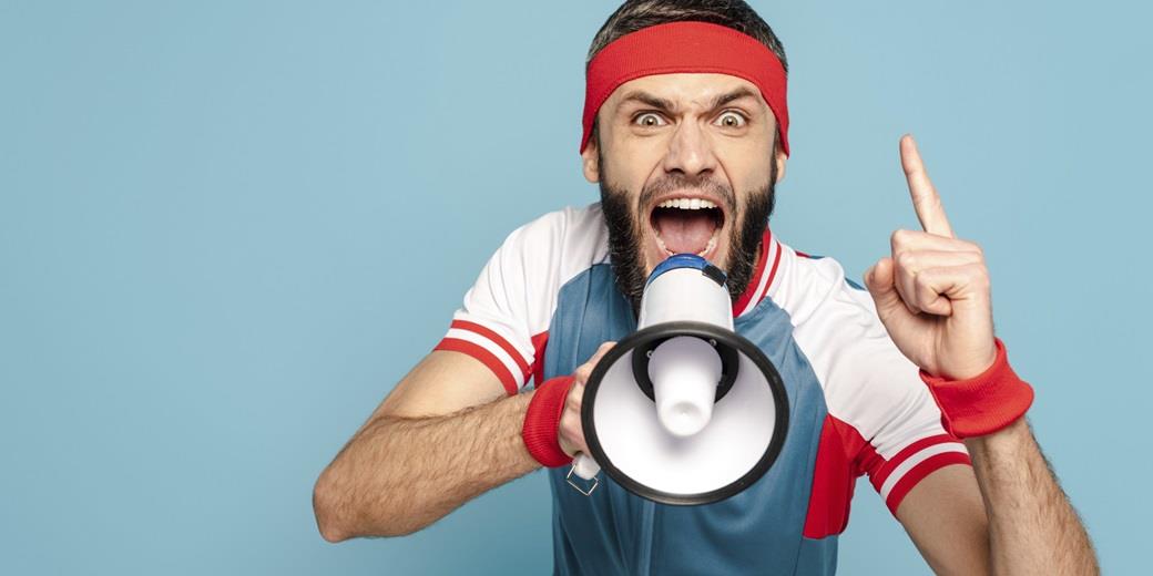 Gym teacher with megaphone shouting