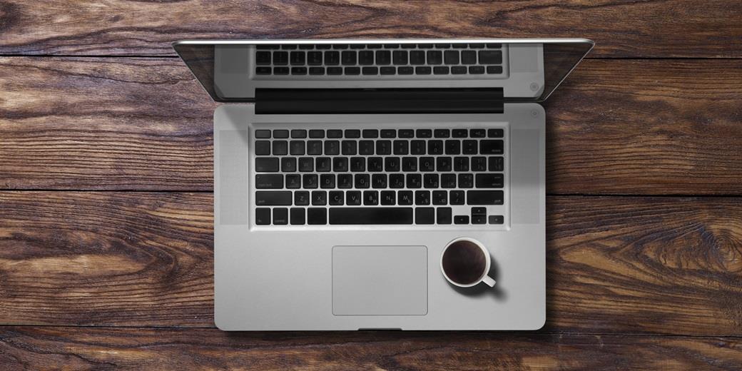 Computer on wooden table
