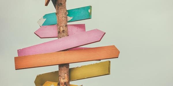 Signs pointing in different directions